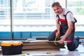 The man laying laminate flooring in construction concept Royalty Free Stock Photo