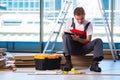 The man laying laminate flooring in construction concept Royalty Free Stock Photo