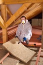 Man laying thermal insulation layer Royalty Free Stock Photo