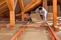 Man laying thermal insulation layer Royalty Free Stock Photo