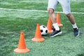 Man Leading Ball between Cones Royalty Free Stock Photo