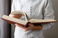 The man is leafing through a huge old book. Royalty Free Stock Photo