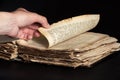 Man leafing through a thick old book Royalty Free Stock Photo