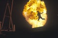 Man leaping through fireball