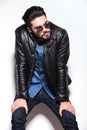 Man in leather jacket and sunlasses looking to his side Royalty Free Stock Photo