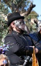 A man in a leather mask of a medieval doctor and a black hat, local festival, a costume performance at community event