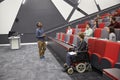 Man lecturing students in a university lecture theatre Royalty Free Stock Photo