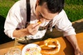 Man in Lederhosen drinking beer