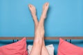 Man legs resting in quarantine at bed at home. Inverted position or therapy against fatigue