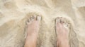 Man legs on sand beach