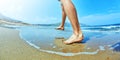 Man legs on sand on the beach Royalty Free Stock Photo