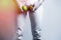 A man at the level of the genitals , holding a ripe and rotten apple. Disease for men. The concept of protection of sexually Royalty Free Stock Photo