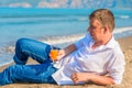 Man lies with a cocktail on the sandy beach Royalty Free Stock Photo