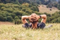 Man lies in high green grass Royalty Free Stock Photo