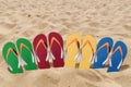 Man lifestyle four relax flip flops on orange beach sand Royalty Free Stock Photo