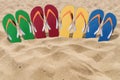 Man lifestyle four relax flip flops on orange sandy beach