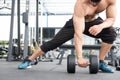 man lift dumbbell in gym. bodybuilder male working out in fitness center. sport guy doing exercises in health club. Royalty Free Stock Photo