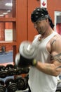 Man lifting dumbbell in gym Royalty Free Stock Photo