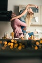 Man lifting his girlfriend and watching her arching her back