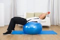 Man Lifting Weights Exercising On Pilates Ball Royalty Free Stock Photo