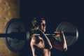 Man lifting weights. muscular man workout in gym doing exercises with barbell Royalty Free Stock Photo