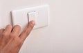 A man with a light switch Royalty Free Stock Photo