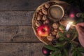 Man lighting a candle in Christmas decor Royalty Free Stock Photo