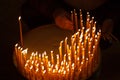 Man lighting candles in a church Royalty Free Stock Photo