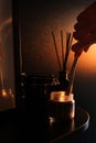 Man lights a candle. the concept of a cozy home relaxing atmosphere. relaxation and aromatherapy Royalty Free Stock Photo