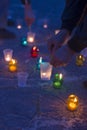 A man lights a candle. Day of Remembrance for the Bereaved