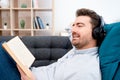 Man listening audiobook and relaxing at home