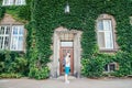 Man listening music building in ivy on background Royalty Free Stock Photo