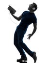 Man listening music digital tablet silhouette Royalty Free Stock Photo