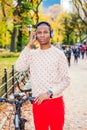 Young African American Man listening Music in Central Park, New