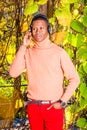 Young African American Man listening Music in Central Park, New