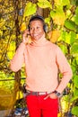 Young African American Man listening Music in Central Park, New