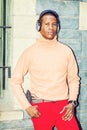 Young African American Man listening Music in Central Park, New