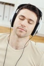 Man listening music with headphones Royalty Free Stock Photo