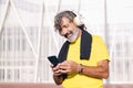 man listening music from phone with headphones Royalty Free Stock Photo