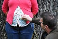 Man listening pregnant belly