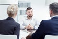 Man listening to examination board