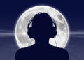 Man listening to the music at the full moon Royalty Free Stock Photo