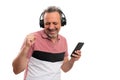 Man listening to music holding phone dancing with copyspace Royalty Free Stock Photo