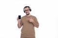 Man Listening to Music from Phone Pointing at It. man Pointing at Phone Green Screen. Isolated