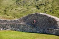 Man with little child, toddler girl on Staigue Fort on the Wild Atlantic Way coastal route, County Kerry, Ireland