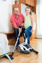 Man and little girl vacuuming at home Royalty Free Stock Photo