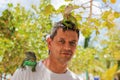 Man with lizards on head and shoulder. Royalty Free Stock Photo