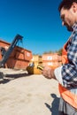 Man loading of construction debris container on truck Royalty Free Stock Photo