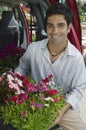 Man Loading Flowers into back of Van Royalty Free Stock Photo