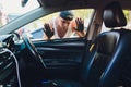 A man that is locked out of his car. Royalty Free Stock Photo